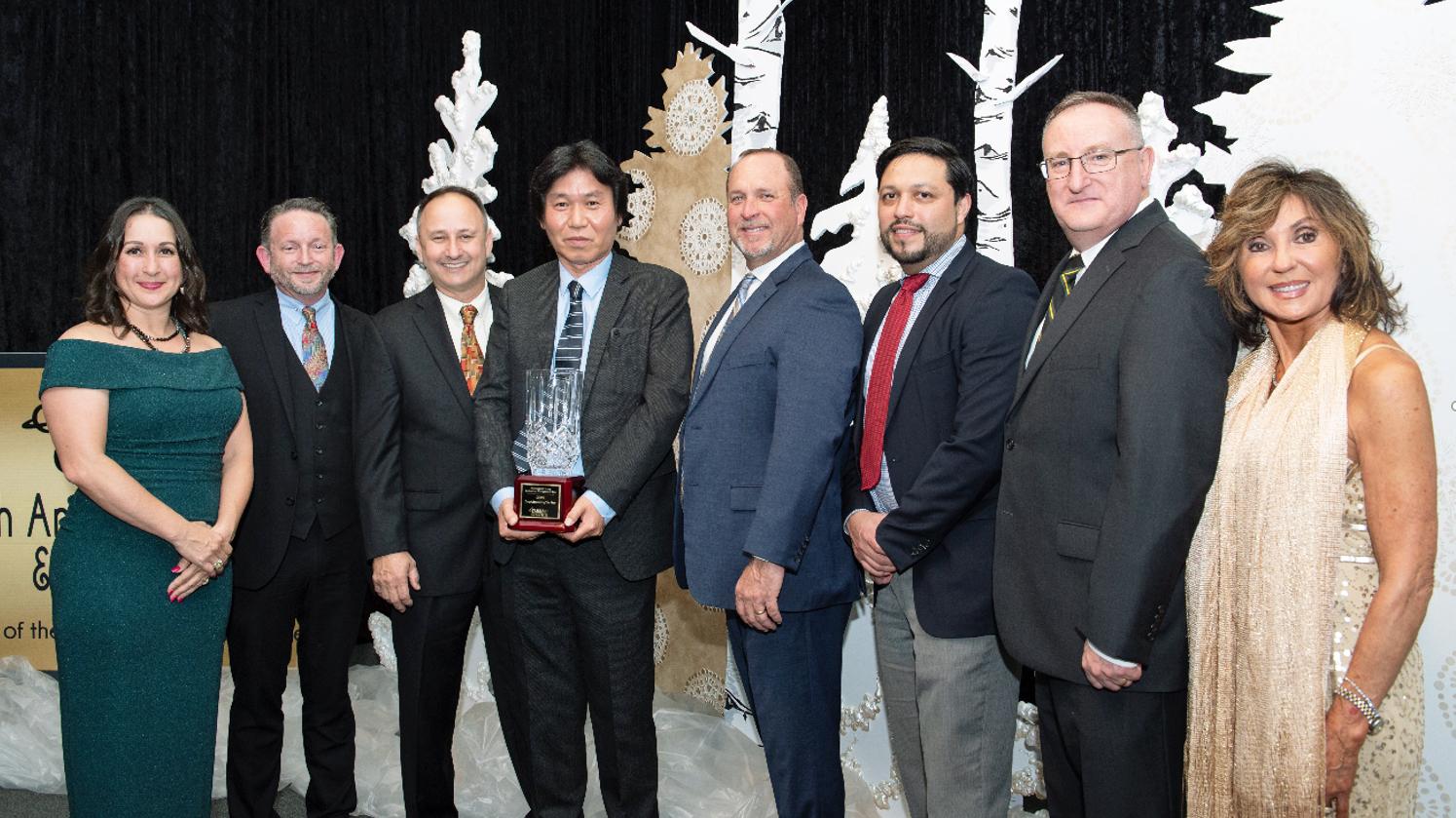 Pearland Chamber of Commerce leadership team presenting the award to MCO-I management.