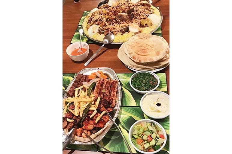 Mandi (top) and kebab (bottom). To be eaten with traditional khubz bread.