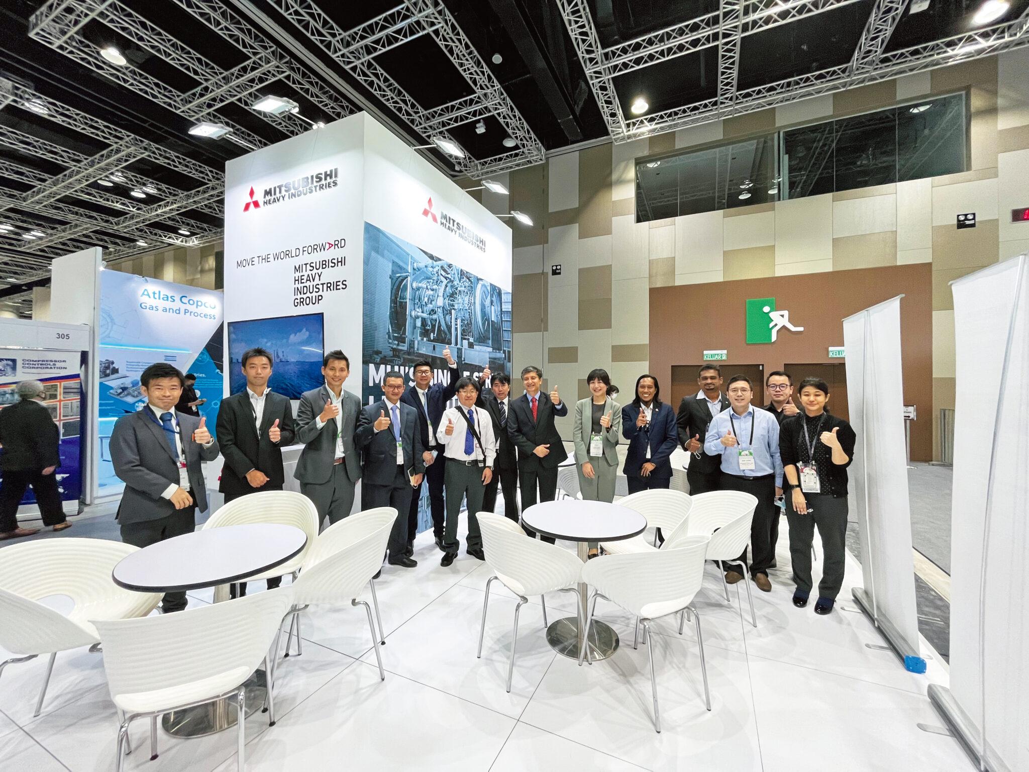 Participants at the MHI Group booth