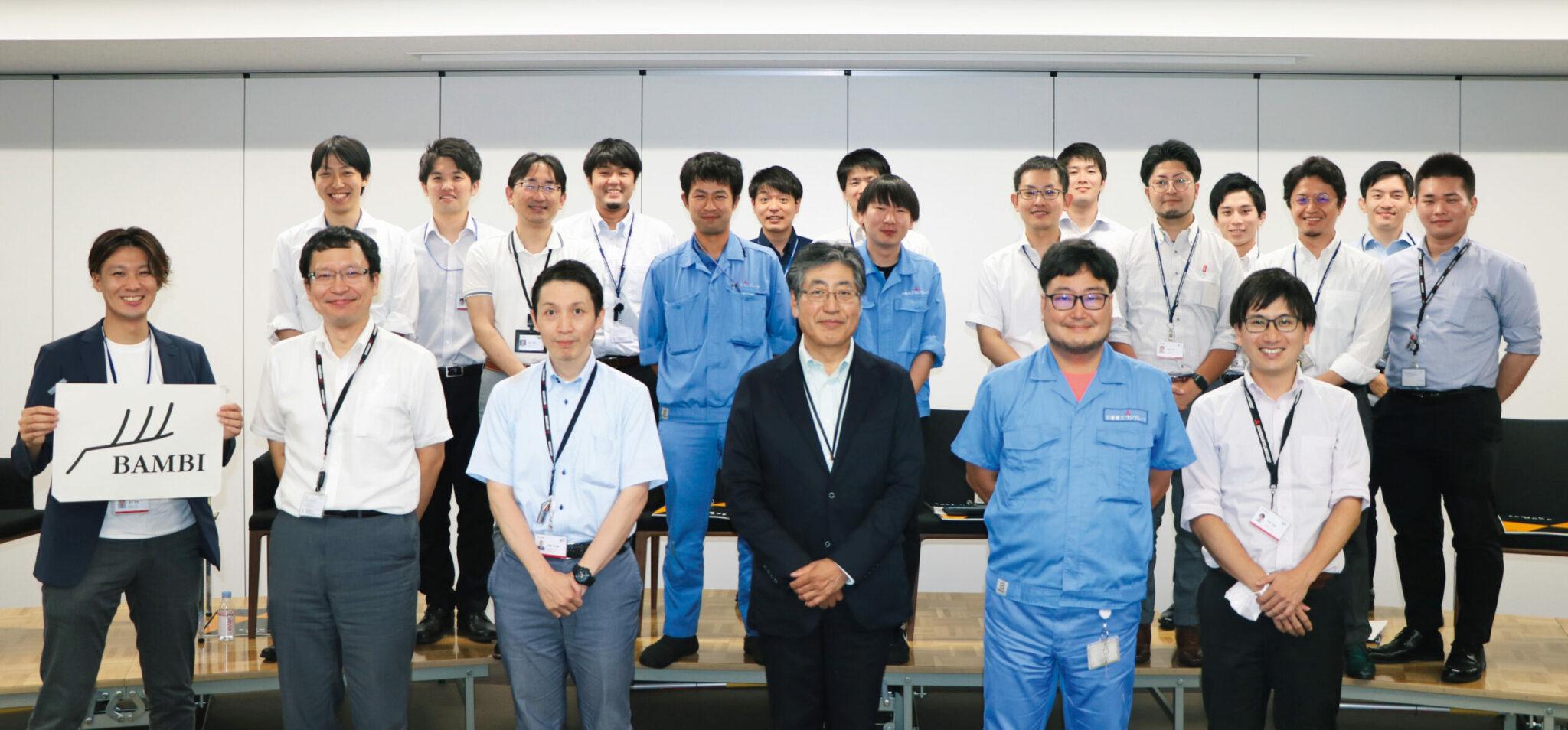 Panelists (front row, third from right: President Hoshi) and members who participated in person