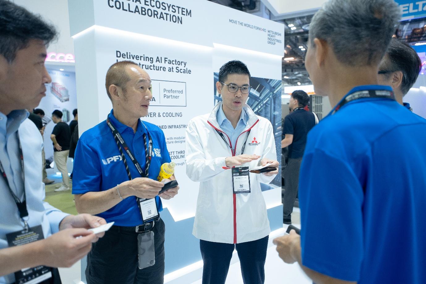 MHI representative discussing data center infrastructure with industry visitors at DCWA 2026