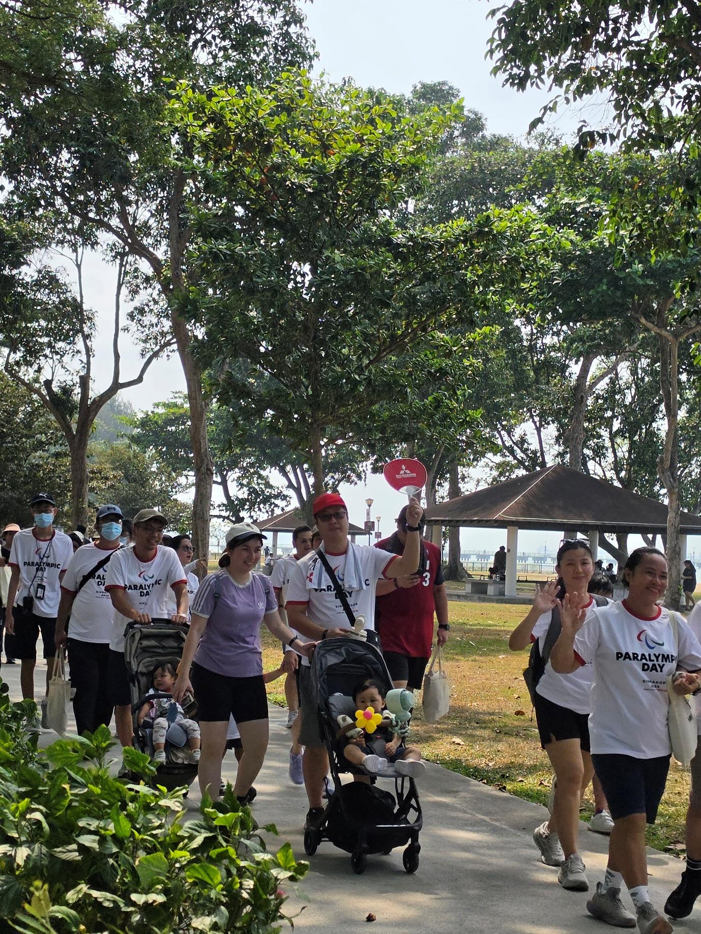 MHI-ESA employees walking with their families during Paralympic Day