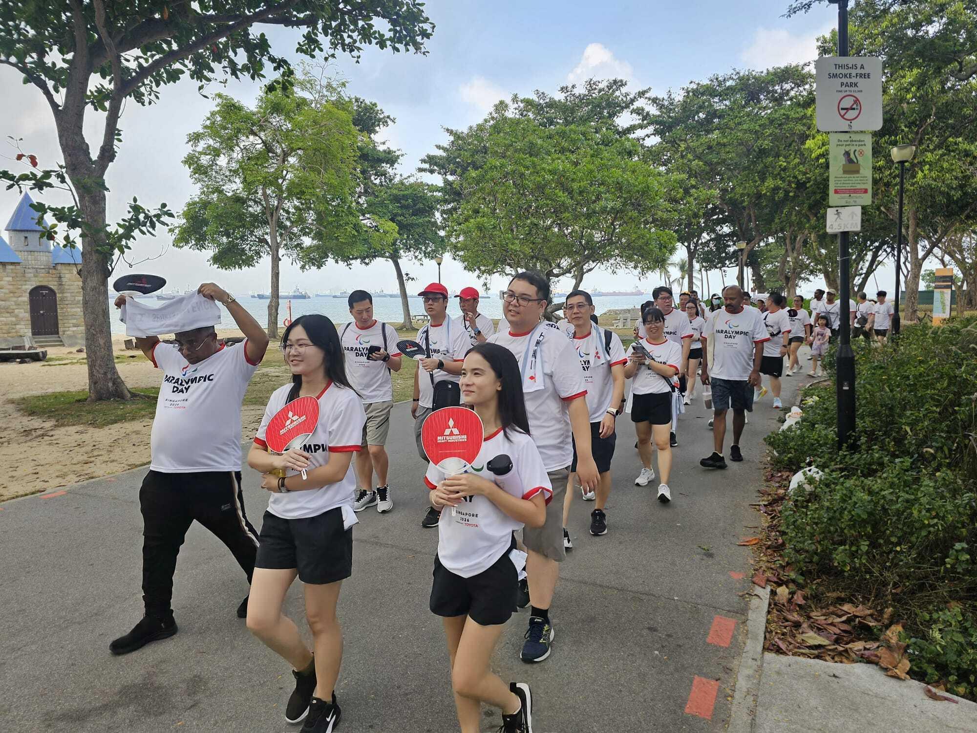 MHI Group colleagues walking together at East Coast Park