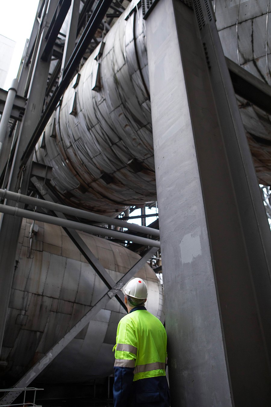 An engineer looks up at the flue gas desulphurisation unit at Drax Power Station. 