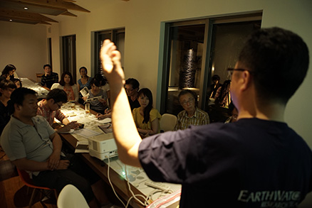 Volunteers for the Tanegashima Loggerhead Sea Turtle Survey (instruction by a research expert before the survey commenced)