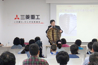 Mr. Matsuzawa showing a marine turtle specimen