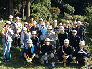 The participating employees (in white helmets).