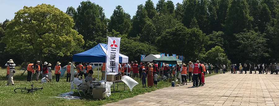 Participants queueing at the reception tent