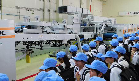 Observing printing machinery in the role of newspaper reporters