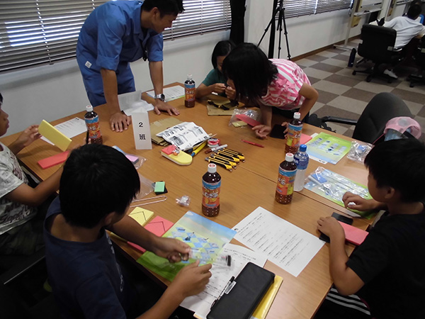 Children making pop-pop boats