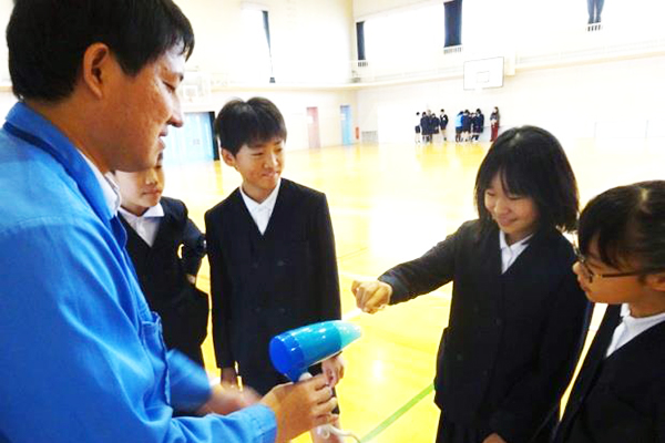 Feeling the air current from a hair dryer