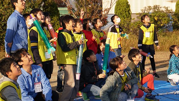 Watching the launched mini pencil water rockets