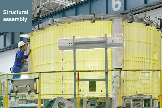 Photo: Workers bore thousands of holes by hand into the joint that connects the first-stage fuel tank to the engine