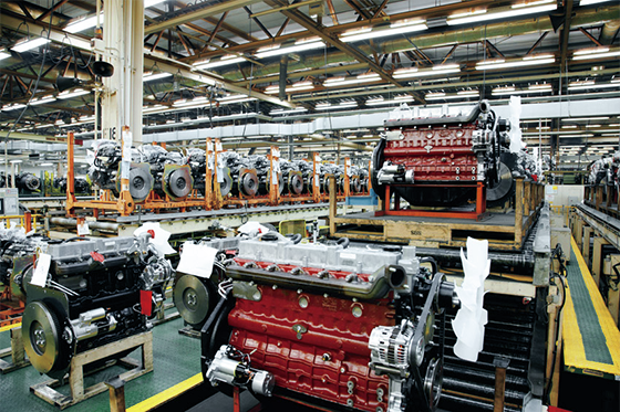 Photo:Small engines in a row on the forklift truck production line.