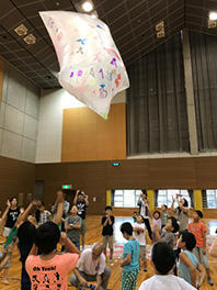 The hot-air balloon rises toward the ceiling.